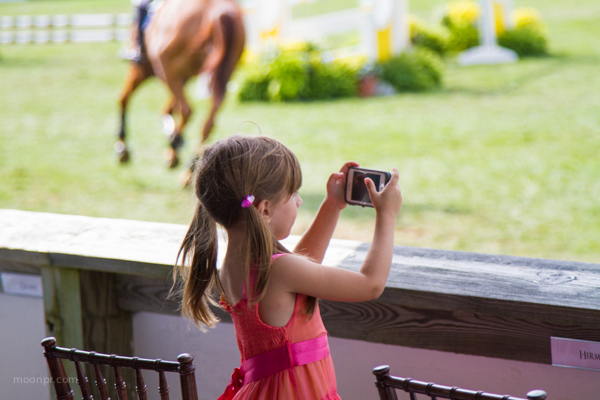 This is absolutely one of my favorite photos. A little shutterbug at the Hampon Classic Horse Show.